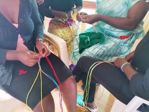 Girls making hand bracelets Large.jpg