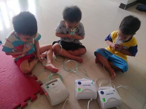 Boys nebulizing Large.jpg