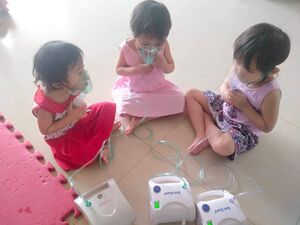 Girls nebulizing Large.jpg